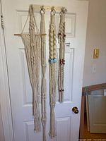 All four macrame hangers on door for full set view