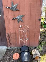 Overview: geese sculptures, trellis, planters, thermometer, feeder, plant supports
