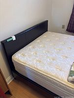 Full view of bed frame with mattress in place