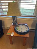 Table with lamp and clock displayed