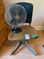 Chair with fan on seat showing overall view