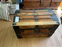 Full view of steamer trunk top and front