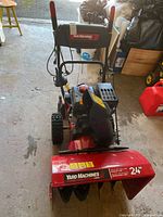 Front view of Yard Machines 24-inch snow blower showing auger housing and controls