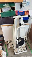 Pfaff CL 404 ironing board folded upright with cords