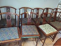 Group of nine cherry wood chairs with upholstered seats