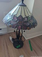 Full view of lamp showing stained glass shade and base