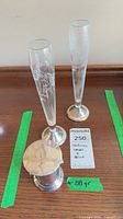 Two etched glass bud vases on sterling bases and sterling container