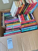 Full box showing assortment of approximately 28 paperback romance and general fiction books