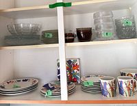 Overview of ceramic and glass pieces inside cabinet