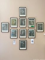 Group view of all ten framed engravings hung on wall