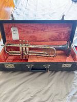 Trumpet in open hard case showing overall condition