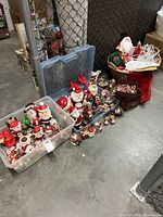 Overall lot showing two totes and a basket filled with assorted Christmas decorations