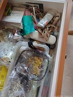 Drawer with mixed sewing notions, trims, glue, cords and patterns
