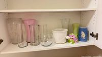 Entire lot arranged on shelf showing all nine pieces