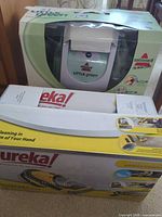 Bissell Little Green and Eureka boxes side by side