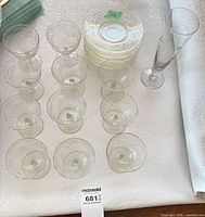 Group view of 11 coupes, 1 flute and stacked plates