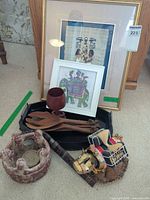 Entire lot showing framed artworks, utensils, tray, ceramic holder, cow figurine and rattle