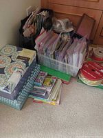 Overall lot with storage boxes, plastic bin, ribbon spools and paper stacks