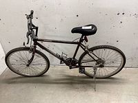 Full side view of Precision PR6030 bicycle showing frame, wheels, handlebars, seat, and kickstand