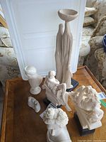 Group shot of all six figurines on table