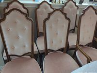 Front view of five chairs showing backs and upholstery