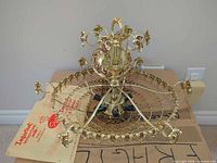 Overall view of disassembled chandelier on box