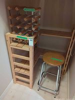 Wood shelving rack with metal wine grid and stool