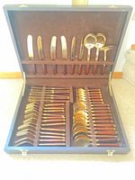 Open case showing full 38-piece flatware set