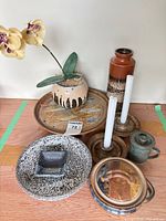 Group shot showing all 8 stoneware pieces