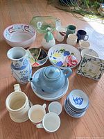 Group shot of all ceramic, porcelain, glass items on floor