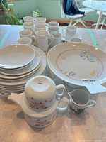 overview of dinnerware, mugs, teapot, creamer