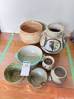 All seven pottery pieces arranged together