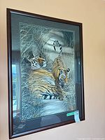 Full view of framed tiger painting hung on wall