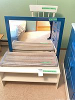 Shelf, mirror, chair and two rugs together