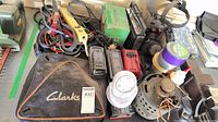 Overview of lot with chargers, generator, radio, respirator, bag, tapes and accessories visible