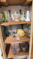 Shelved assortment of all vases, planters and pitchers in lot