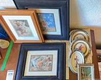 Group of framed needlepoints and embroidered ovals