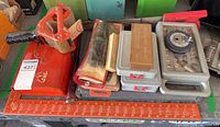 Group view of all hand tools, cases, pump can and measuring ruler