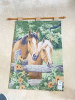 Full view of tapestry hanging on rod