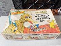 Top of box showing Big Bird’s Blunderproof Walking Letters Set branding