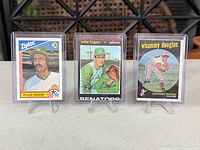 Front view of all three cards in plastic holders