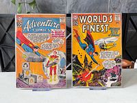 Front covers of both bagged comic books on stands