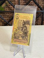 Goldback Florida 1/2 note in sleeve on stand, full view