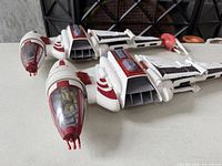 Oblique view of spacecraft showing both cockpits and overall color scheme