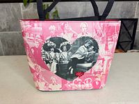 Front view showing pink canvas, heart collage, rhinestone trim, red heart accent