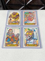 All four Leaf Gross Outs cards in sleeves