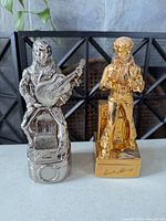 Front view of both Elvis decanters showing finishes and poses