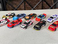 All ten die-cast cars grouped on table