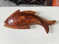 Full view of assembled fish-shaped carved wood box