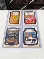 All four Wacky Packages cards in sleeves